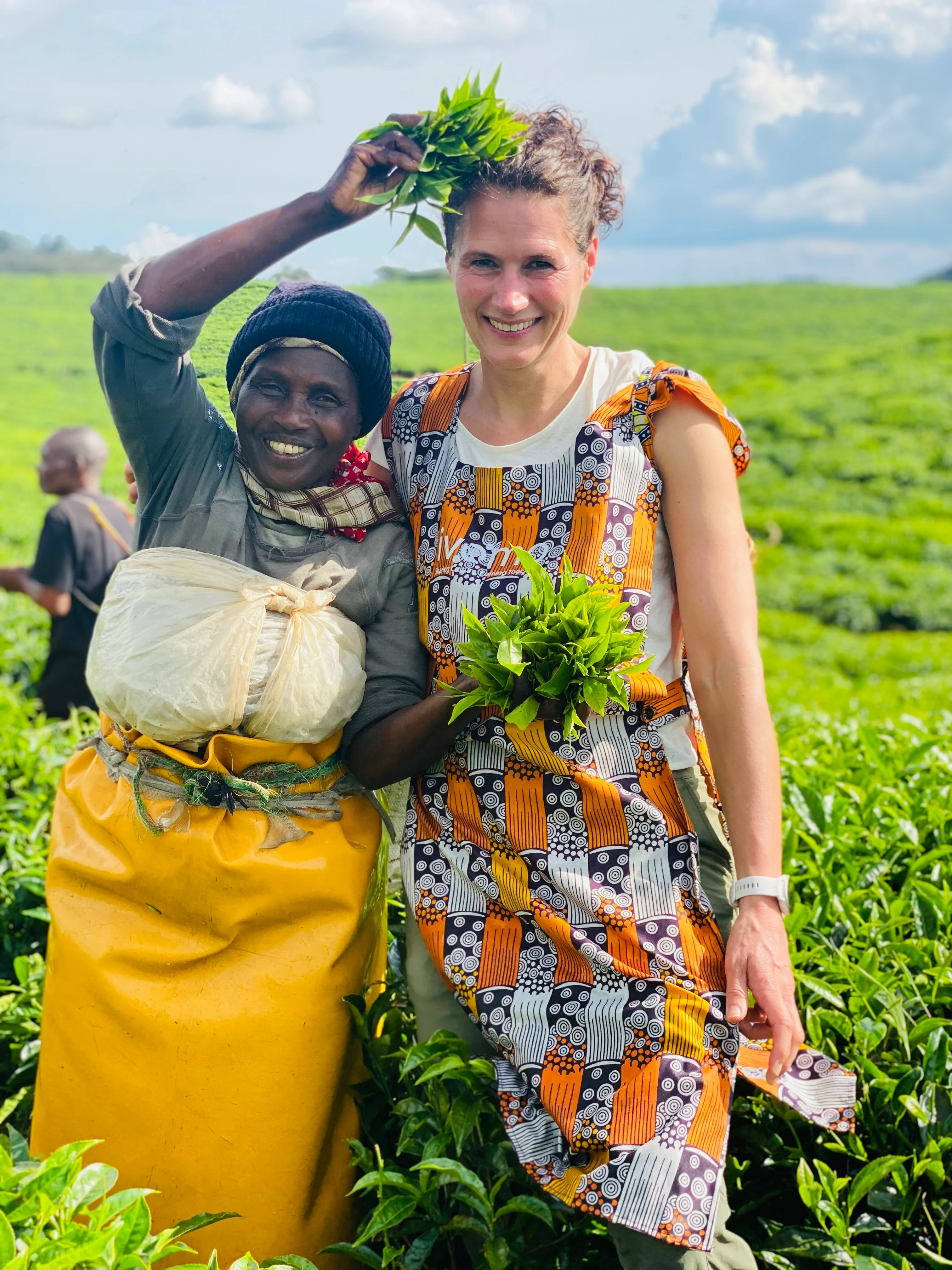 RW-Nuyngwe-National-Park-Tea-Plantation-Lady-and-Seraphine (1).webp