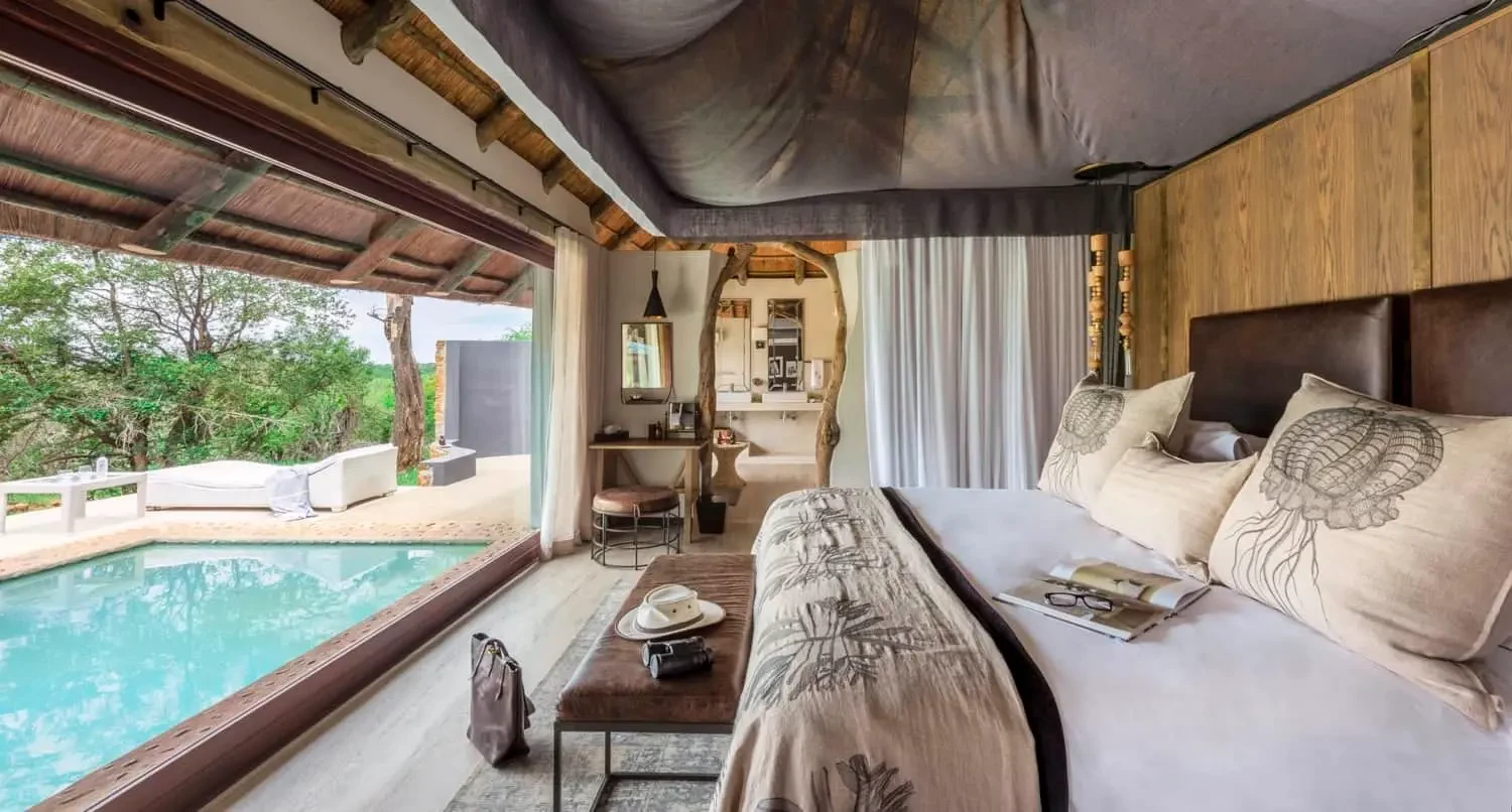 ZA- leopard hills - ground level luxury suites bedroom poolview.webp