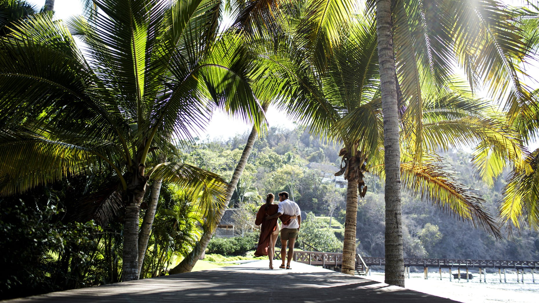 MX-Accommodatie-Four Seasons Tamarindo-couple walk at beach.jpg