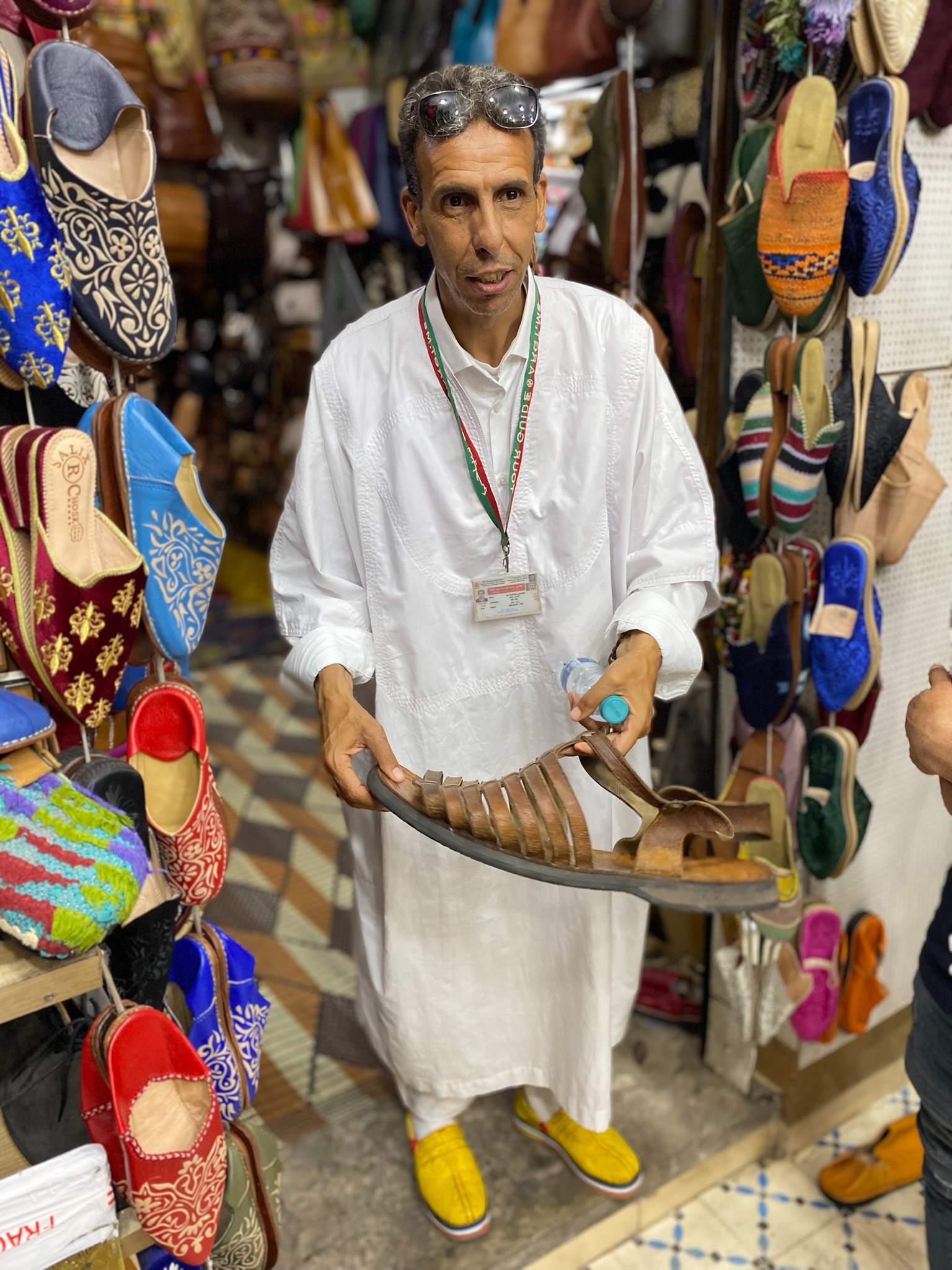 MA - Marrakech Medina tour guide with shoe.JPEG