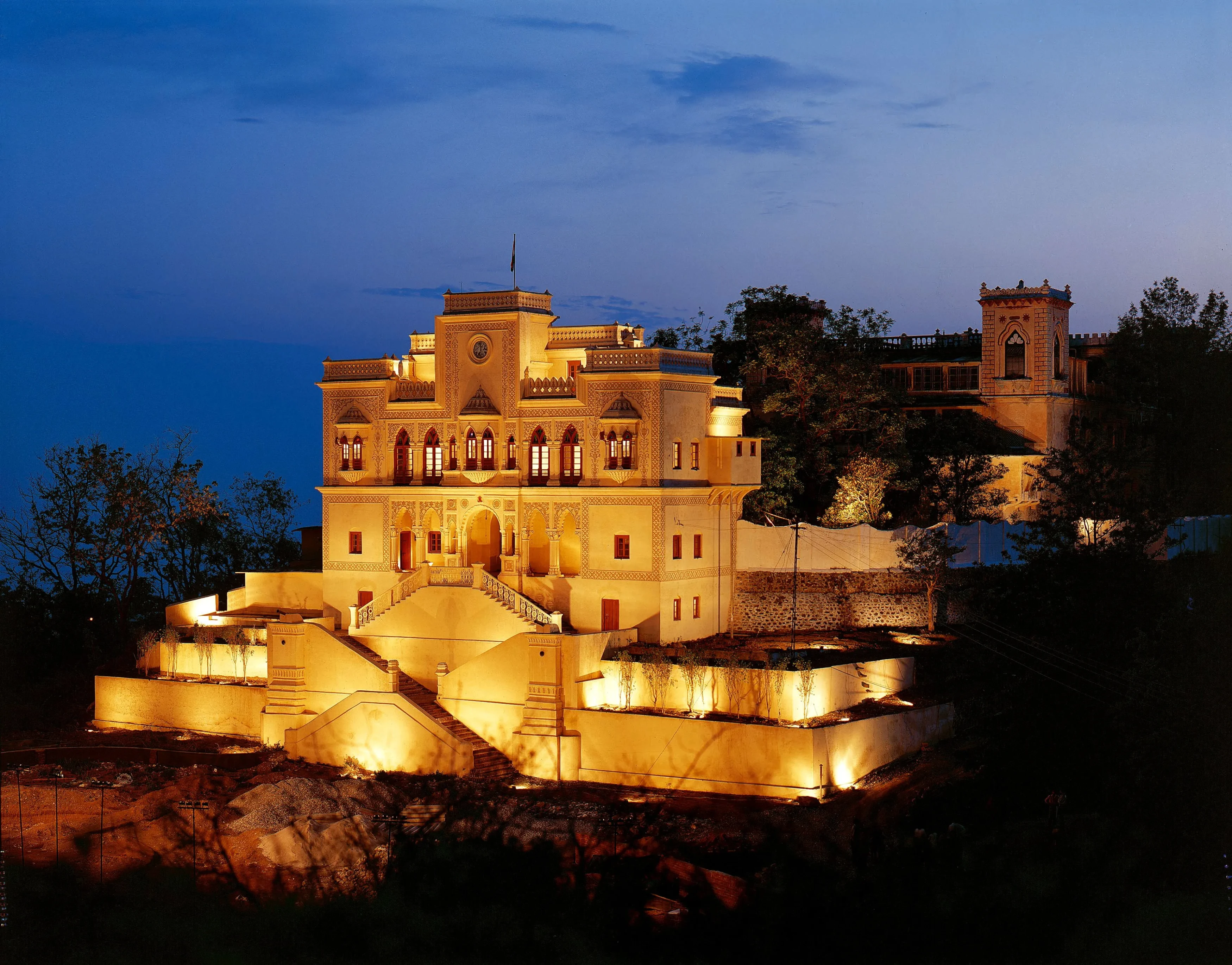 IN-Ananda in the Himalaya - hotel exterior at night.webp