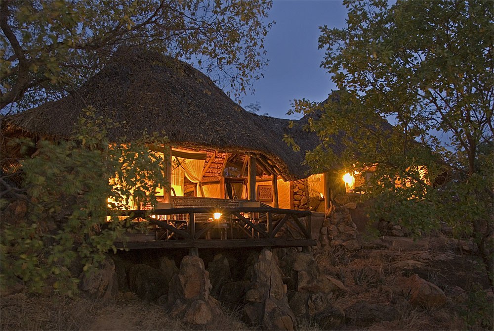 KE - Elsa's kopje - Lodge exterior at night.jpg