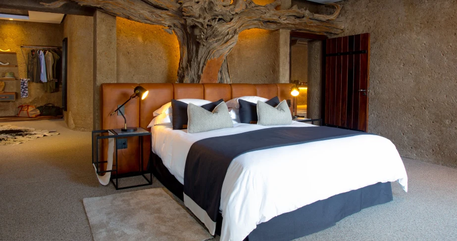 ZA-Sabi Sabi Earth Lodge-Amber Villa Main_Bedroom.webp
