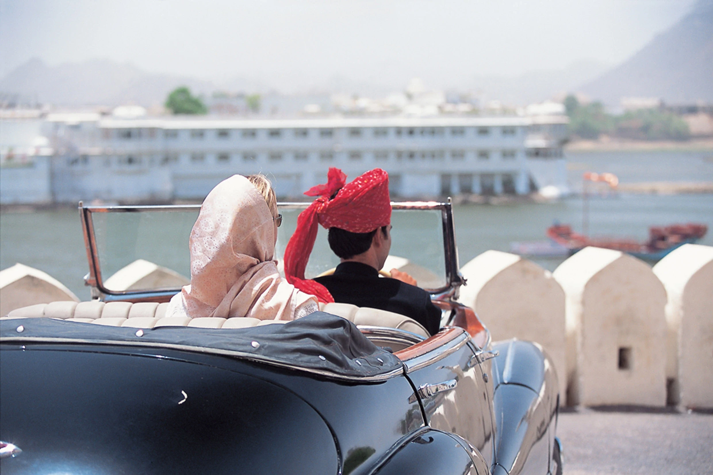 IN - Taj Lake Palace - Couple in car and view.webp