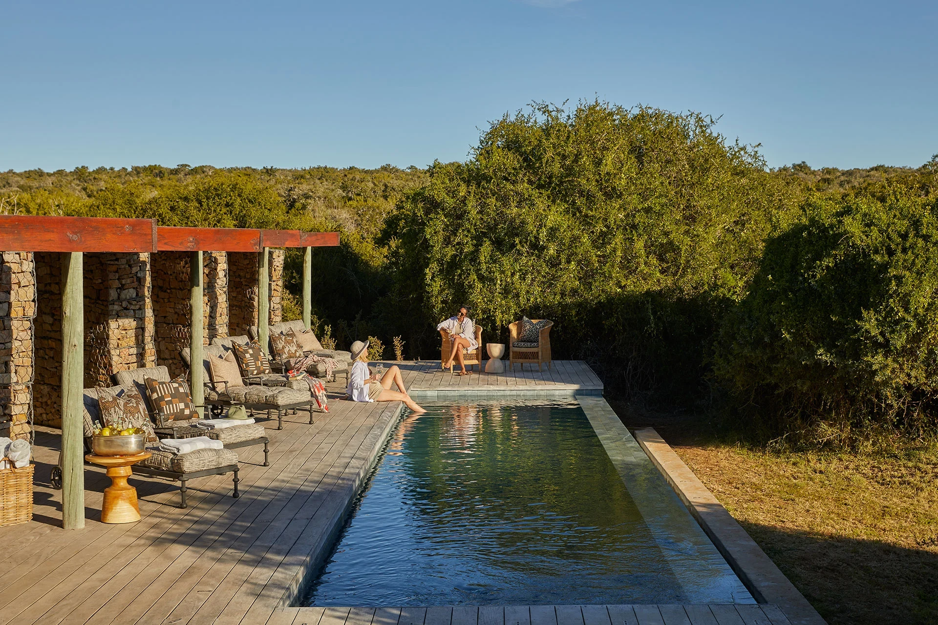 ZA-Kwandwe Ecca Lodge-Main-area-pool-relaxing.webp