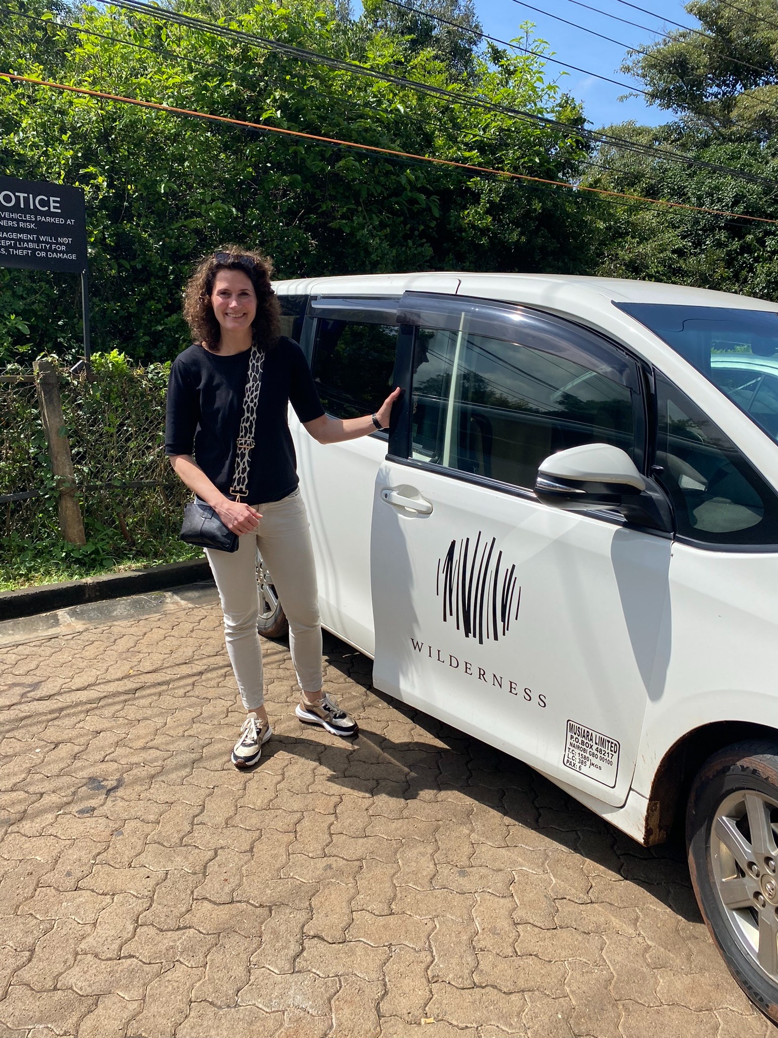 KE - Seraphine at Wilderness transfer vehicle in Nairobi.JPEG