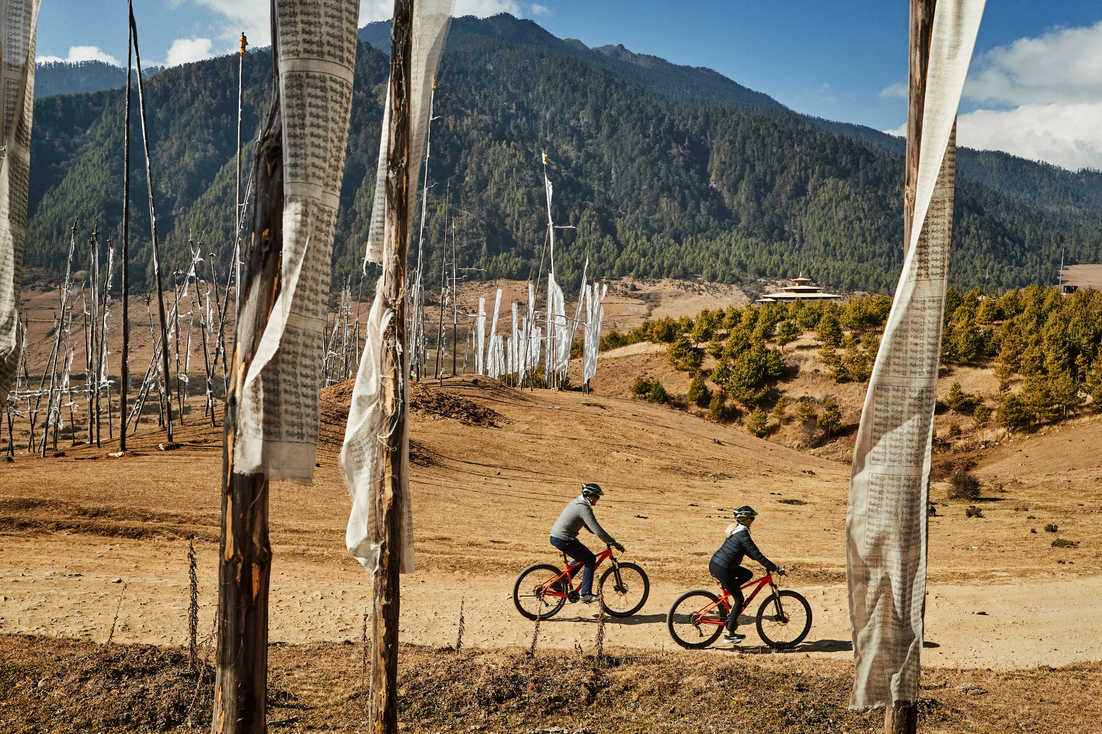BT-Six Senses-Gangtey Mountain biking prayer flags.webp